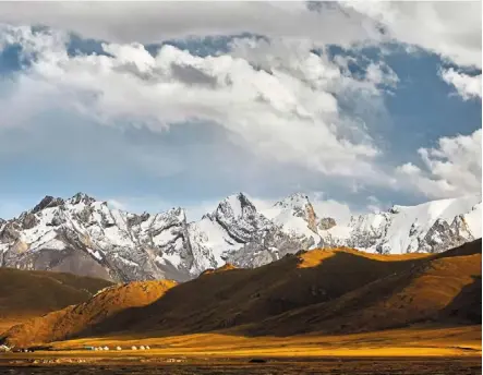  ?? ?? marvel at the breathtaki­ng view in Kyrgyzstan.