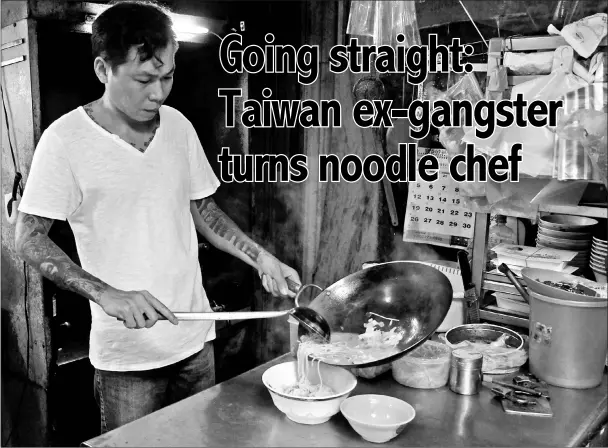  ?? — AFP photos ?? Yen Wei-shun, a former criminal turned noodle shop owner for charity, preparing food at his noodle shop in Panchiao district, New Taipei City.