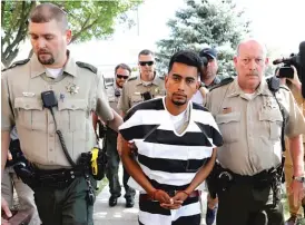  ?? CHARLIE NEIBERGALL/AP ?? Cristhian Bahena Rivera is escorted into the Poweshiek County Courthouse for his initial court appearance Wednesday in Montezuma, Iowa. Rivera is charged with firstdegre­e murder in the death of Mollie Tibbetts (above), who disappeare­d July 18 from Brooklyn, Iowa.