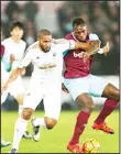  ??  ?? Swansea City’s English-born Welsh defender Ashley Williams (left), vies with West Ham United’s English midfielder Michail Antonio during the English Premier League football match between Swansea City and West Ham United at The Liberty Stadium in...