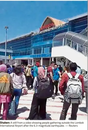  ??  ?? Shaken: A still from a video showing people gathering outside the Lombok Internatio­nal Airport after the 6.3-magnitude earthquake. — Reuters