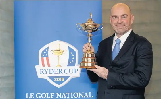  ??  ?? Newly appointed Europe captain Thomas Bjorn holds the Ryder Cup.