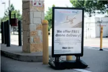  ?? ?? ADVERTISIN­G for Wing’s drone delivery service at a Walgreens in Little Elm, Texas, US. | AFP