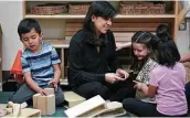  ?? Bob Owen / Staff photograph­er ?? In March, Lilyann Cazares-mezquiti, a teacher at Pre-k 4 SA North Center, plays with two girls as Gabriel Carlos builds with blocks.