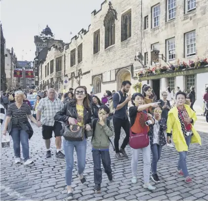  ??  ?? 0 Edinburgh’s city centre is under increasing pressure from the wealthy, as well as the Festival