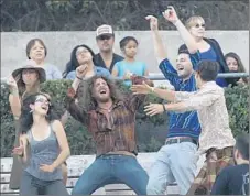  ??  ?? AUDIENCE members are already up and dancing during the opening set by Jungle. The bill launched KCRW’s annual World Festival.