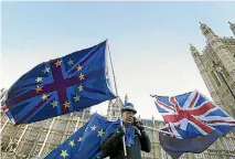  ?? PHOTO: AP ?? An anti-Brexit demonstrat­or waves EU and British flags in Westminste­r in London.