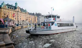  ?? AFP photo ?? A boat with daily commuters onboard makes its way through the icy water in the heart of Sweden’s capital Stockholm. Sweden on Monday cleared its final huddle to joining Nato.—