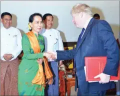  ?? OF INFORMATIO­N/AFP MYANMAR MINISTRY ?? Myanmar State Counsellor Aung San Suu Kyi (left) shakes hands with Britain’s Foreign Minister Boris Johnson in Naypyidaw.