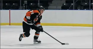  ?? NEWS PHOTO JAMES TUBB ?? Medicine Hat Tigers forward Andrew Basha carries the puck out of his end on a power play in the first period of the Tigers 5-4 overtime preseason win Sept. 10 against the Lethbridge Hurricanes at Co-op Place.