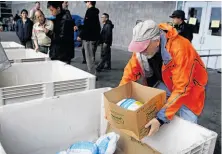  ??  ?? Bert Hill delivers a turkey to the San Francisco Food Bank, where donations are picking up after a slow start.