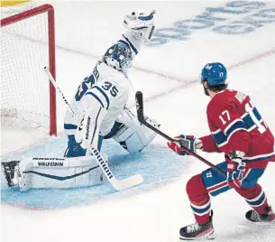  ?? RYAN REMIORZ THE CANADIAN PRESS ?? Goalie Petr Mrázek, making his Leafs debut, robs the Canadiens’ Josh Anderson with a quick glove hand in the second period on Monday in Montreal. Anderson ended the night with two goals.