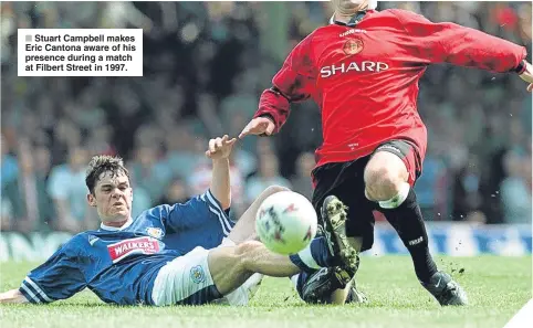  ??  ?? Stuart Campbell makes Eric Cantona aware of his presence during a match at Filbert Street in 1997.