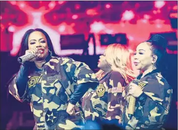  ?? Juan O’Campo Andrew Bernstein Associates / Microsoft Theater ?? KANDI BURRUSS, left, Tamika Scott and Tameka Harris of Xscape sing Saturday at Microsoft Theater.