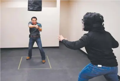  ??  ?? Jimmy Graham, left, a former Navy SEAL, will be teaching a “close-quarters defense system” at the Active Shooter Response Training Center in Centennial. RJ Sangosti, The Denver Post