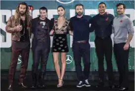  ??  ?? This Nov 3, 2017 file photo shows “Justice League” cast members Jason Momoa, from left, Ezra Miller, Gal Gadot, Ben Affleck, Ray Fisher and Henry Cavill at a photo call for the film in London.
— AP photos