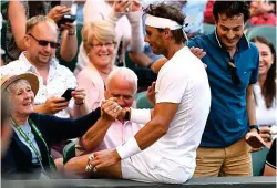  ?? GETTY IMAGES ?? Fans’ favourite: Nadal apologises after falling on to a woman during his win over Del Potro