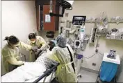  ?? Gina Ferazzi Los Angeles Times ?? WORKERS TREAT a COVID patient at Riverside University Health System in Moreno Valley in May.