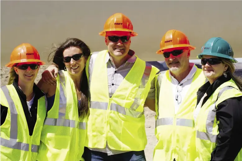  ??  ?? Jeff Ciachurski, centre, with his team from Western Wind at one of their wind farm projects in the United States.