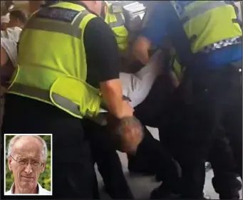  ??  ?? Mob-handed: Five transport police officers grab 65-year-old Tony Nuttall, inset