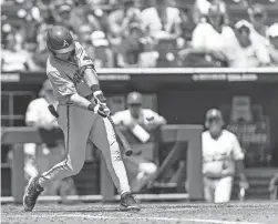  ?? JOHN PETERSON/AP ?? Arkansas’ Chris Lanzilli hits a three-run home run in the fifth inning against Stanford during the Men’s College World Series on Saturday in Omaha, Neb.