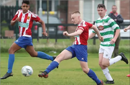  ??  ?? Laytown United captain Craig Scully fires the ball into the net to equalise against neighbours Donacarney Celtic in the Under-16 SFAI Cup match on Sunday.