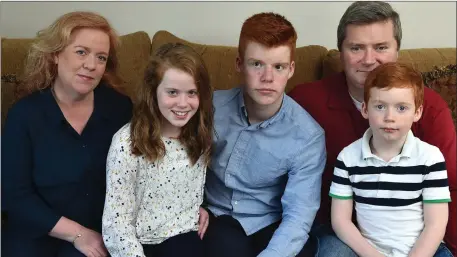  ?? Photo by Domnick Walsh ?? PKU sufferer Maeve Quilter (11) at home in Lixnaw with her mother Siobhán, father Liam, and brothers Liam Jnr and Eoin, as the family take part in a campaign to get the Government to fund a vital drug that could improve Maeve’s quality of life no end.