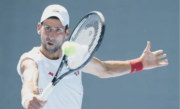  ??  ?? Serbia’s Novak Djokovic practices at the Ariake Tennis Park ahead of the Tokyo 2020 Olympic Games in Japan.