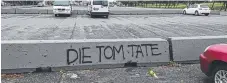  ??  ?? Graffiti aimed at Mayor Tom Tate at The Spit yesterday.