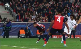  ??  ?? Willian’s deflected volley rises and loops over the Lille goalkeeper for Chelsea’s second goal. Photograph: Kieran McManus/BPI/Shuttersto­ck