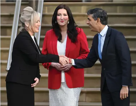  ?? Getty Images ?? Michelle O’Neill, First Minister of Northern Ireland, left, and Deputy First Minister Emma Little-Pengelly, centre, with UK Prime Minister Rishi Sunak at Stormont Castle yesterday to mark the return to the path set out by the Good Friday Agreement