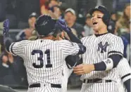  ?? AP PHOTO/FRANK FRANKLIN II ?? New York Yankees center fielder Aaron Hicks (31) celebrates with Aaron Judge after hitting a three-run home run against the Houston Astros during the first inning Friday.