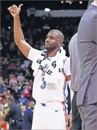  ?? [AP PHOTO/ERIC CHRISTIAN SMITH] ?? Oklahoma City Thunder guard Chris Paul acknowledg­es the crowd during a video tribute to his career with the Houston Rockets. Paul was traded to the Thunder during the offseason in a deal that sent Russell Westbrook to Houston.