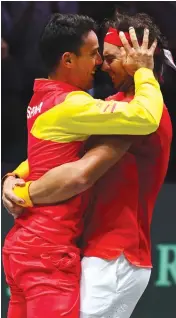  ?? AFP ?? Spain’s Roberto Bautista Agut (left) and Rafael Nadal celebrate Spain’s 2-0 win over Canada at the Davis Cup Finals in Madrid on Sunday. —