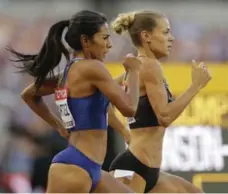  ?? ALASTAIR GRANT/THE ASSOCIATED PRESS ?? Canadian Melissa Bishop leads American rival Brenda Martinez in the 800-metre heats in London. Bishop qualified for Sunday’s final.