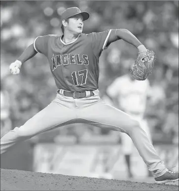  ?? Bob Levey Getty Images ?? SHOHEI OHTANI gave a lot of credit to Angels catcher Martin Maldonado for his early success this season.