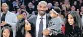  ?? AP ?? ■ LA Lakers great Kobe Bryant with his family at the ceremony to retire his two jersey numbers.