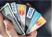  ??  ?? Consumer credit cards are shown in North Andover, Mass. Children can be victims of identity theft and it often goes unnoticed by parents for years.
CAN I FREEZE MY CHILD’S CREDIT REPORT?