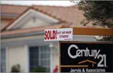  ?? FILE PHOTO ?? A real estate sign is posted outside a home.