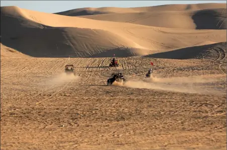  ?? JOSELITO VILLERO FILE PHOTO ?? Off-highway vehicle enthusiast­s climb a hill at Buttercup Sand Dunes west of Yuma on Dec. 31, 2012.