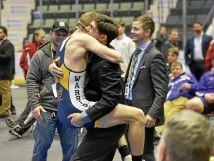  ?? STAN HUDY - SHUDY@DIGITALFIR­STMEDIA.COM ?? Averill Park’s Jake LaFountain jumps into the arms of his coach, Mike Malenfant after winning the 152-pound Section II Division 1title Saturday at the Cool Insuring Arena in Glens Falls. February, 10, 2018.