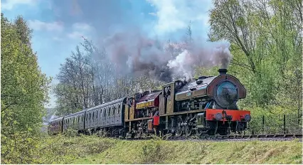  ?? DAVE HEWITT ?? On April 30 visiting Bagnall 0-6-0ST No. 403 Victor leads twin No. 401 (Vulcan) with a passenger service from Percy Main to Middle Engine Lane during the North Tyneside Steam Railway gala.