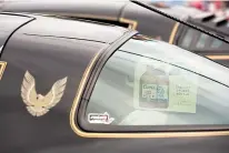  ?? Staff photo by Joshua Boucher ?? A case of Coors is seen in the back window of a Pontiac Trans Am on Saturday at the Four States Auto Museum in downtown Texarkana. The plot of “Smokey and Bandit” involves a hijinks-filled adventure from Atlanta, Ga., to Texarkana, Texas, and back with...