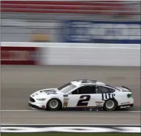  ?? STEVE MARCUS — THE ASSOCIATED PRESS ?? Brad Keselowski races during qualifying for the NASCAR Cup auto race at the Las Vegas Motor Speedway on Friday in Las Vegas. Keselowski won the pole position, continuing Ford’s early season dominance.