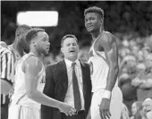  ?? RALPH FRESO/ASSOCIATED PRESS ?? Arizona star freshman Deandre Ayton, right, and coach Sean Miller are embroiled in an alleged pay-for-play deal.