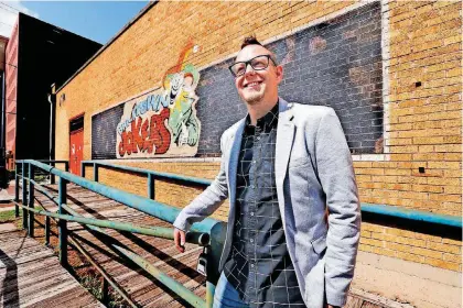  ?? [PHOTO BY STEVE SISNEY, THE OKLAHOMAN] ?? Rodney Wardwell, an associate pastor at The Bridge Church, shows the building at 229 E Sheridan in Bricktown that will be redevelope­d as a community center.