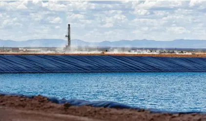  ?? Callaghan O'Hare / Bloomberg ?? A pond used in hydraulic fracturing is shown in West Texas’ Reeves County in August. Water is quickly becoming a multibilli­on-dollar business in the area’s Permian Basin.