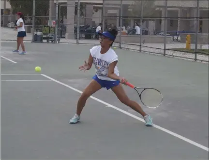  ??  ?? Brawley Union High No. 1 doubles team player Elaisa Tango-On competes in a home tennis match against Vincent Memorial on Monday afternoon. KARINA LOPEZ PHOTO