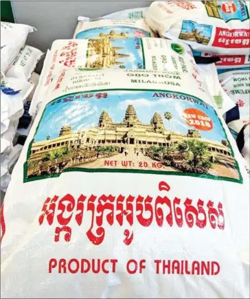  ?? SUPPLIED ?? CRF and Ministry of Commerce officials are looking into the company responsibl­e for the use of Angkor Wat as a logo on rice sacks.