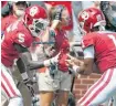  ?? [PHOTO BY BRYAN TERRY, THE OKLAHOMAN] ?? Rock, paper, scissors, whatever Kyler Murray and Marquise Brown (5) did against FAU worked.